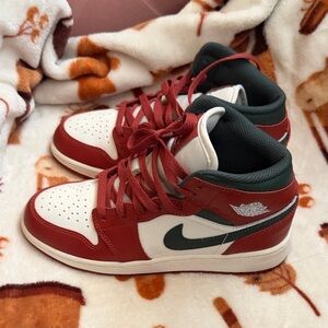 Red and White Sneakers with Green Accents
Nike Air Jordans size 4.5 big kids.